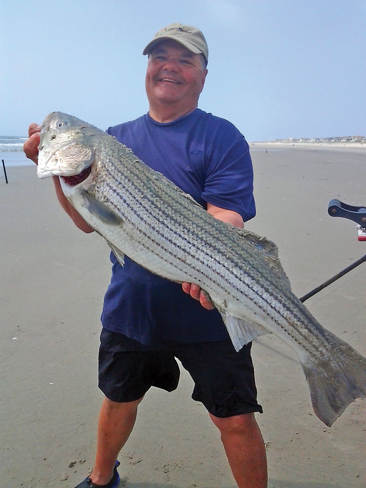 Manny Butera holding up the fish he caught