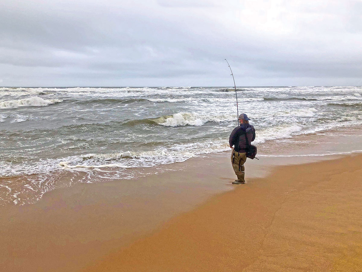 Man on the shore fishing