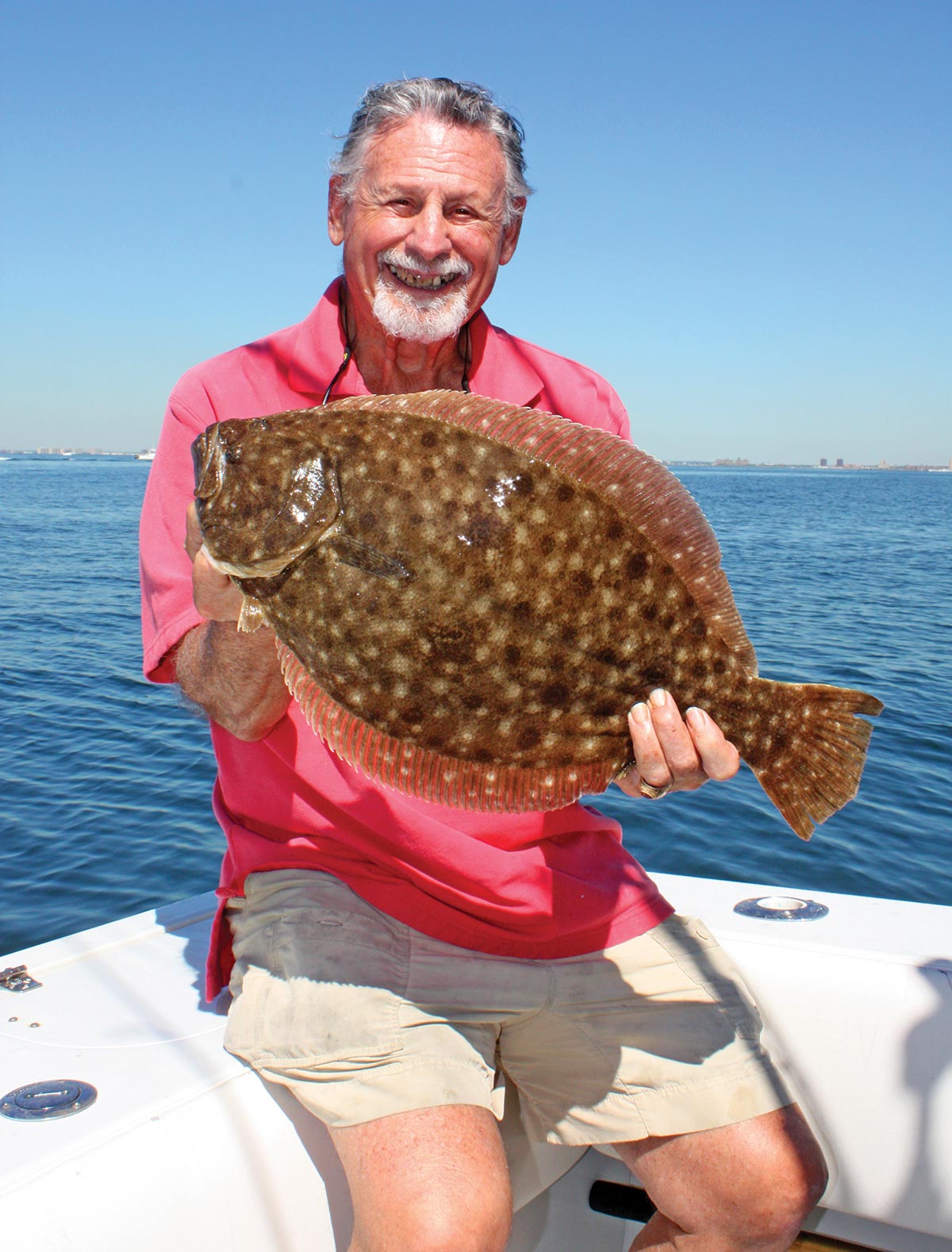 Al Ristori holding a fluke fish