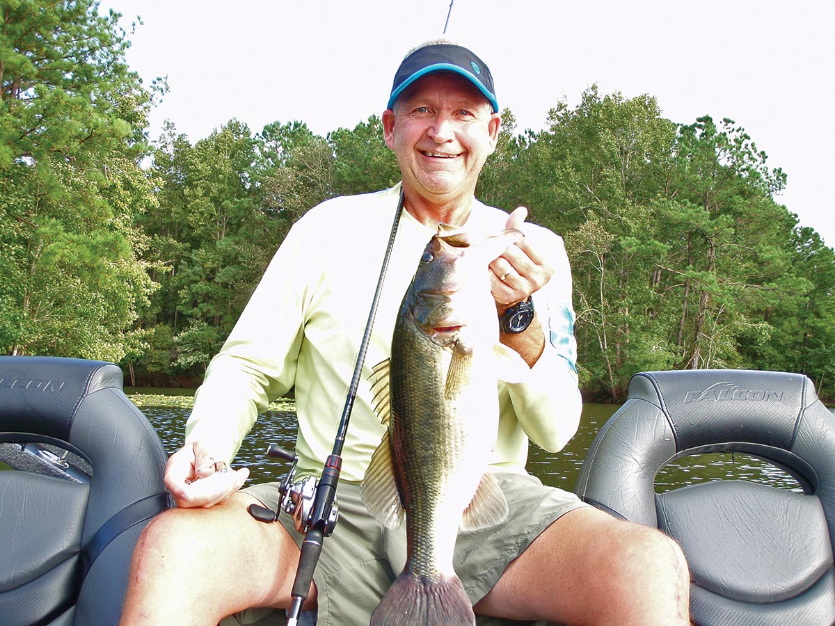 Tom Melton shows off a fat largemouth that was feeding on baitfish