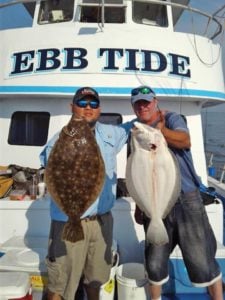 Showing off fish on a boat