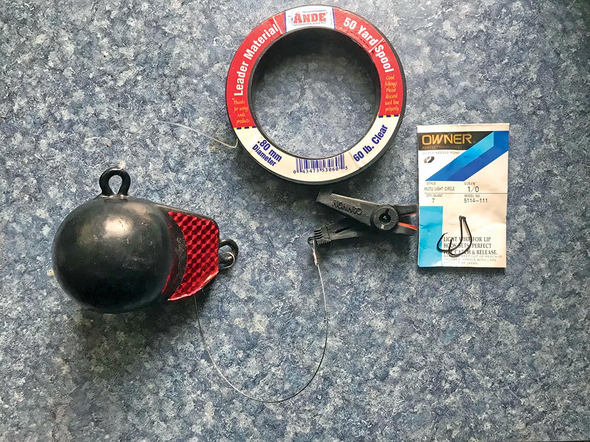 The author uses a small downrigger ball suspended on heavy monofilament below his kayak to keep his bait in the strike zone.