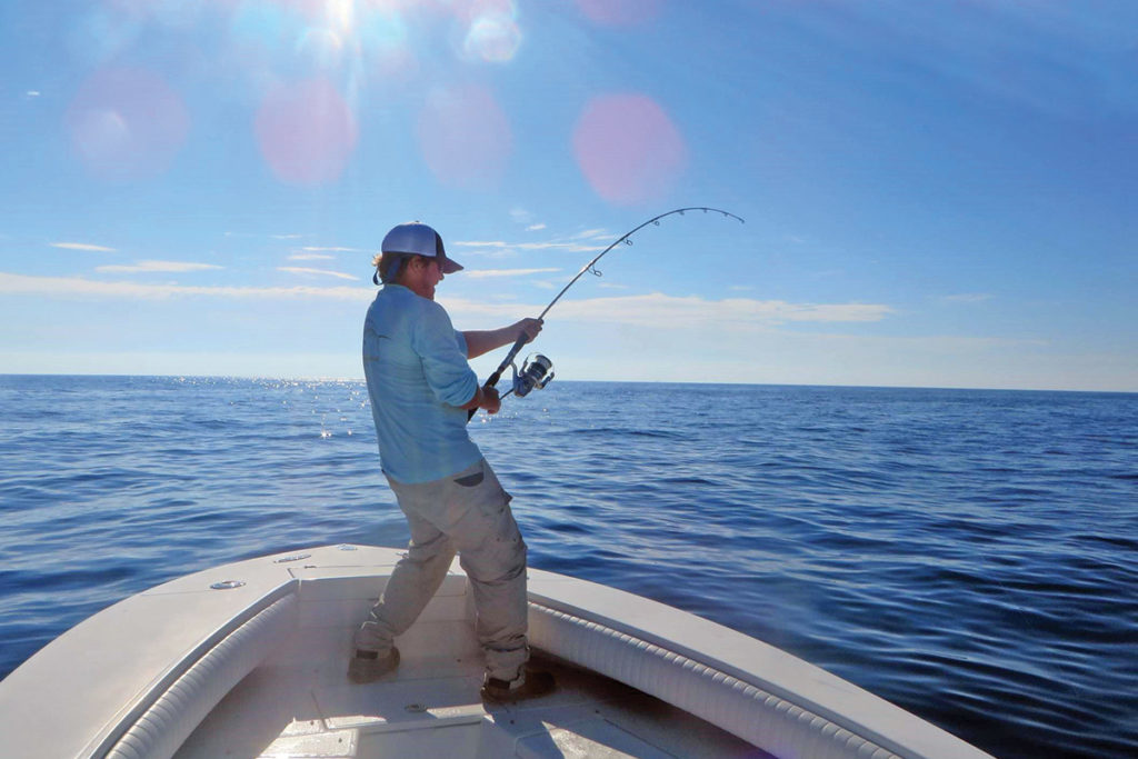 Capt. Kirk Fay paying special attention not to go too high while fighting this tuna.