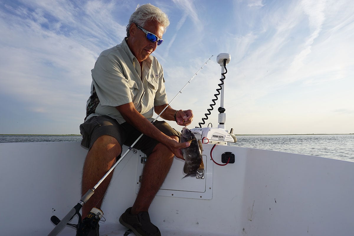 John DeBona unhooks a tautog