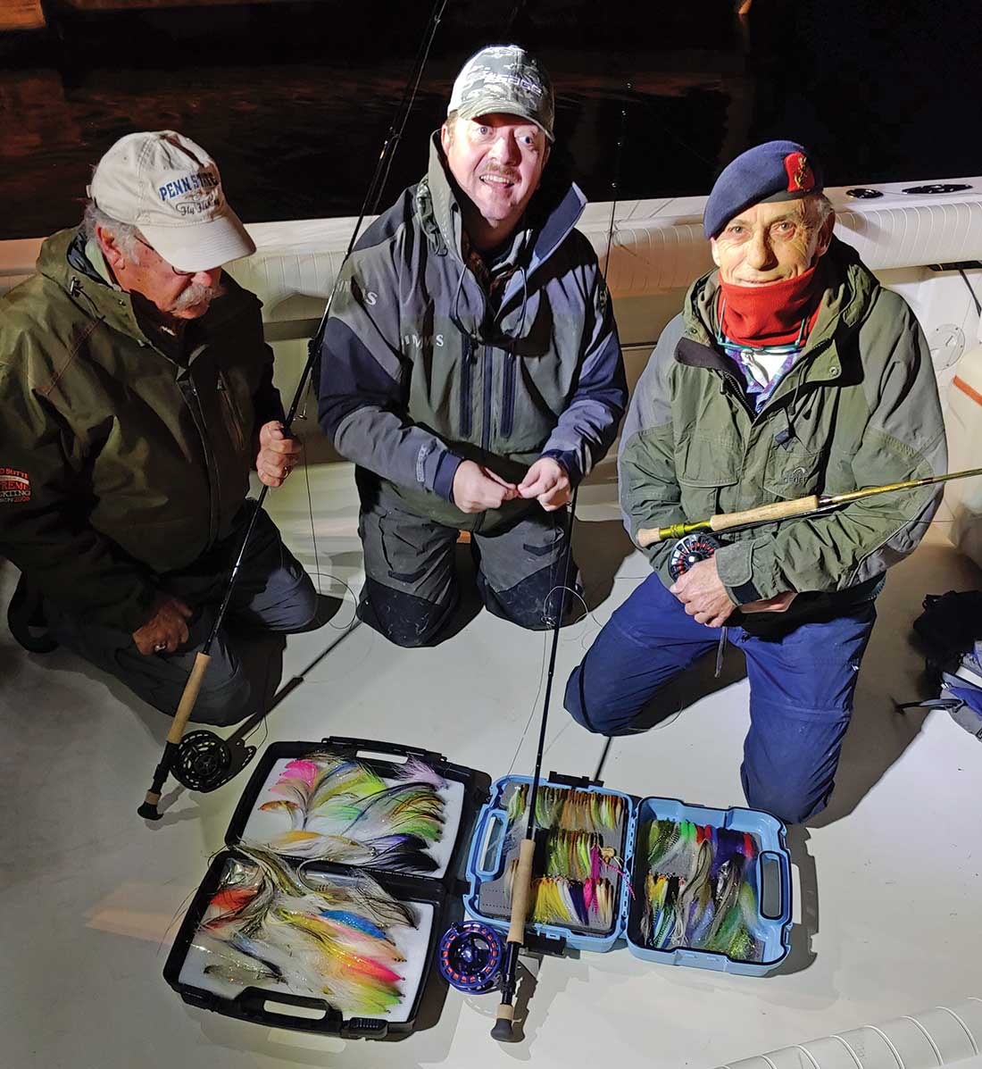 Chuck Furminsky of the Fly Fishing Show, Harry Schoel from Belgium, and Theo Bakelaar from the Netherlands getting ready selecting the right fly for the day onboard Shore Catch Sportfishing