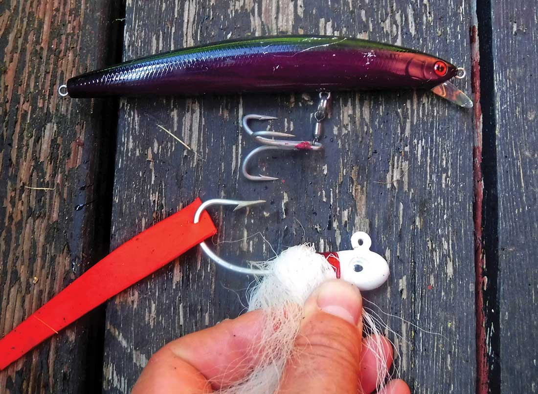 The large, single hook of a bucktail