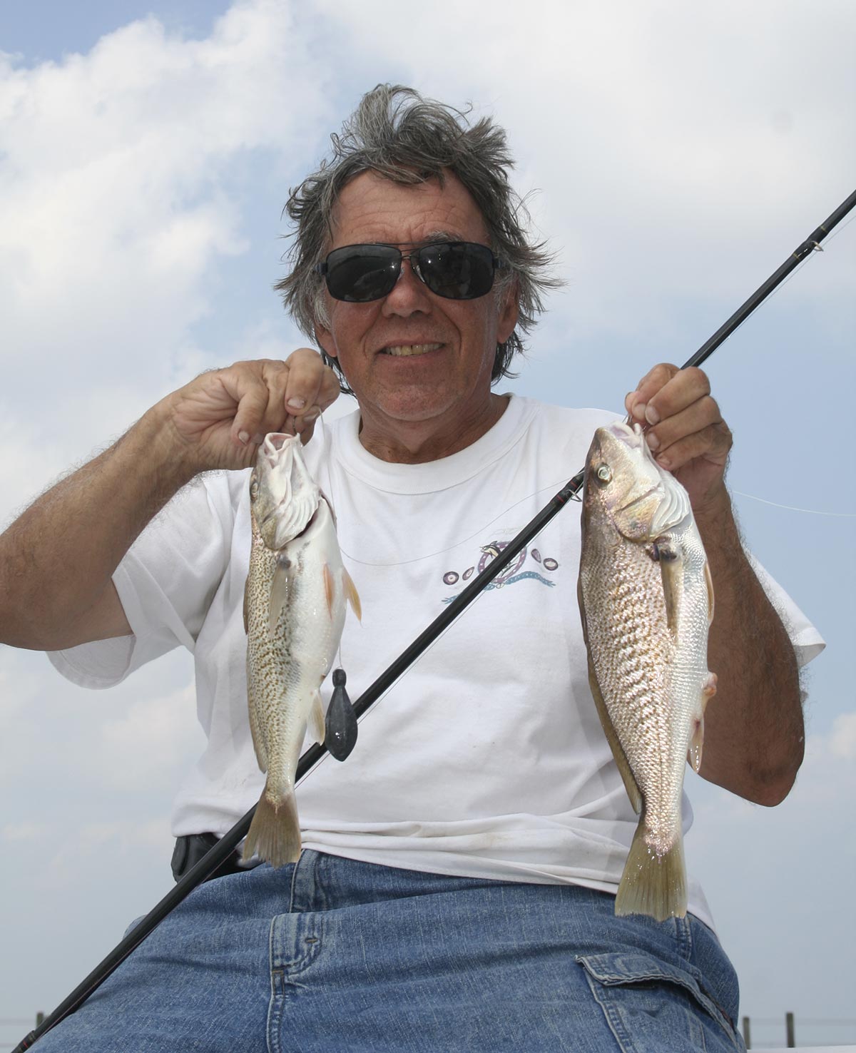 Mike Pizzolato with a brace of Delaware Bay croaker. 