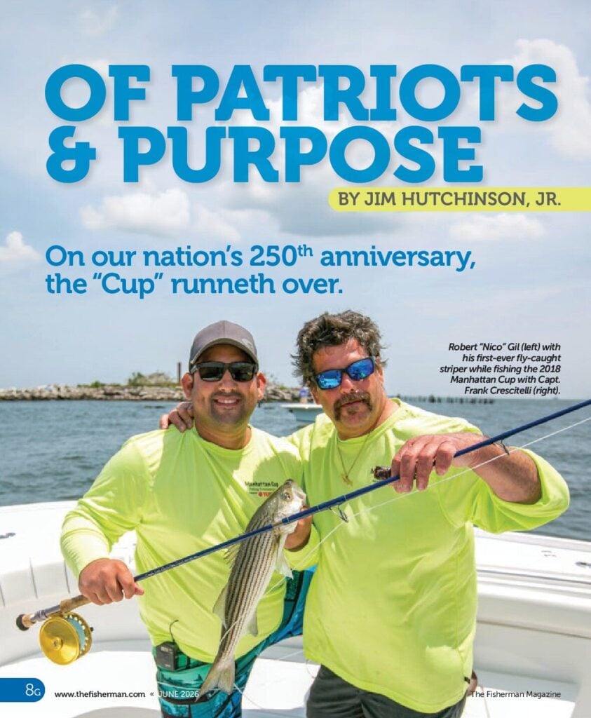 Robert "Nico" Gil and Capt. Frank Crescitelli holding a striped bass on a boat, both wearing neon green shirts.